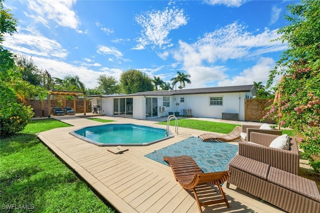 view of pool featuring cooling unit, a patio area, and a wooden deck