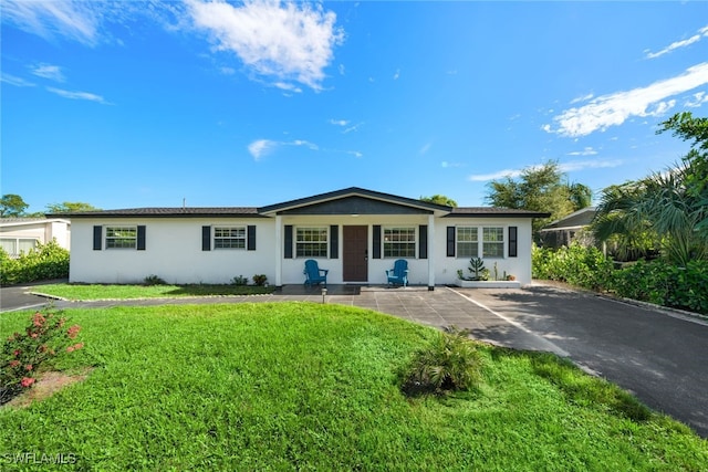 ranch-style house with a front yard