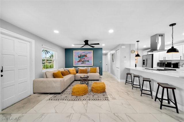 living room featuring ceiling fan