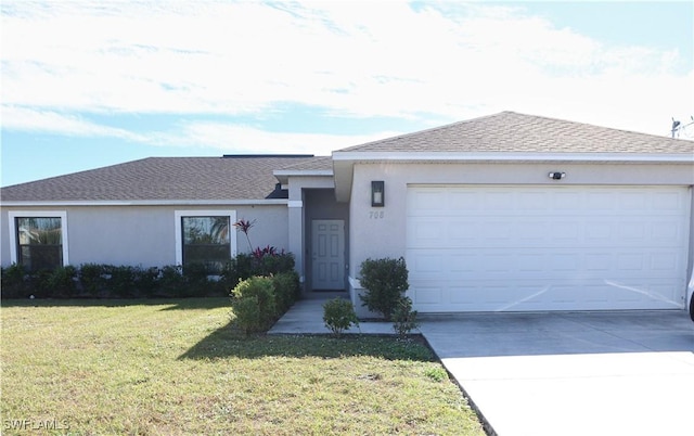 ranch-style home featuring a garage and a front lawn