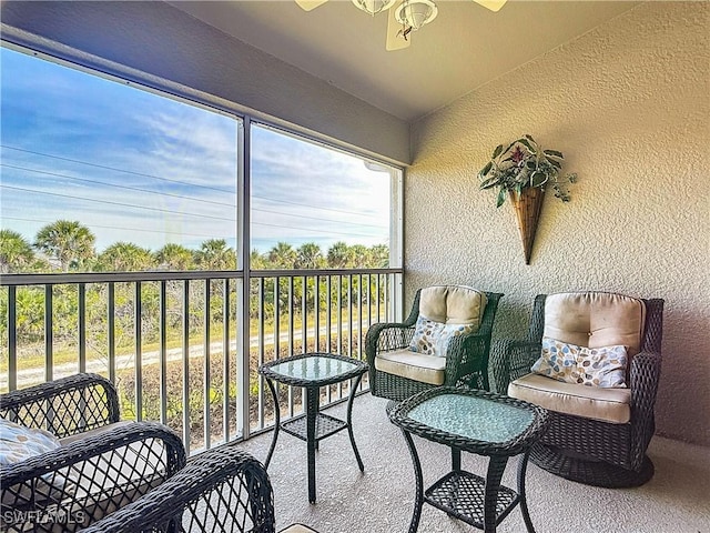 sunroom with vaulted ceiling and ceiling fan