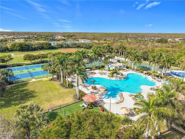 view of pool featuring a water view, a yard, and a patio