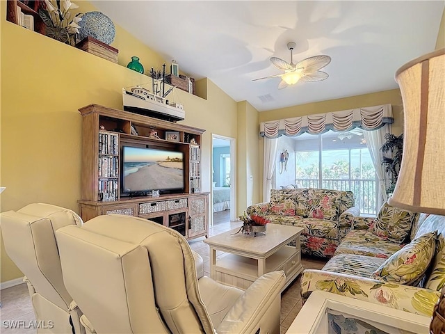 living room featuring ceiling fan and lofted ceiling