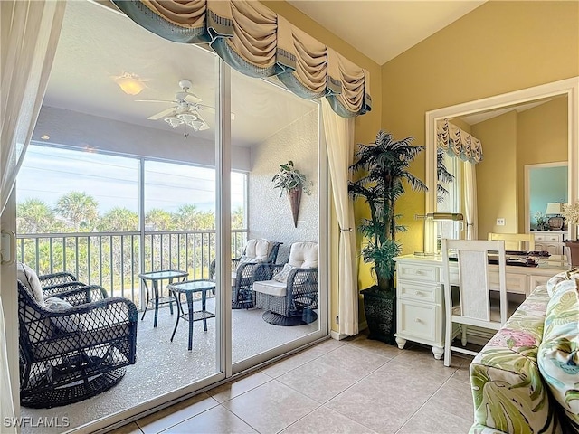 sunroom featuring vaulted ceiling and ceiling fan