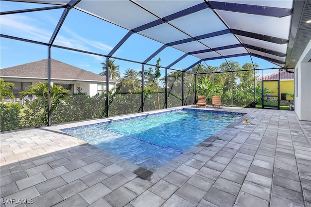 view of pool with a lanai and a patio area