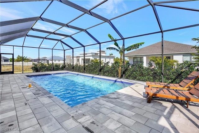 view of pool featuring a patio area and a lanai