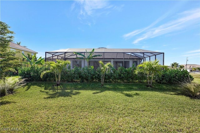 view of yard featuring glass enclosure