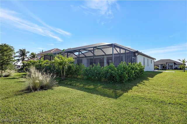 view of yard with glass enclosure