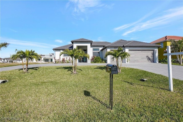 view of front facade featuring a garage and a front lawn