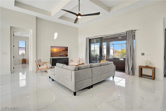 living room featuring ceiling fan, beam ceiling, and coffered ceiling