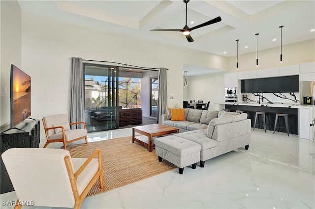 3307 NW 3rd St, Cape Coral, FL 33993 - living room featuring marble finish floor, coffered ceiling, ceiling fan, and a high ceiling