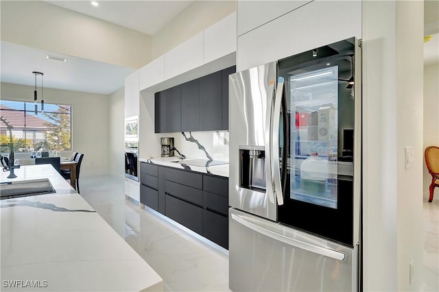 3307 NW 3rd St, Cape Coral, FL 33993 - kitchen featuring appliances with stainless steel finishes, a sink, and modern cabinets