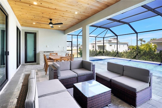 view of patio featuring a lanai and an outdoor living space