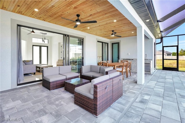 view of patio / terrace featuring a lanai and an outdoor living space