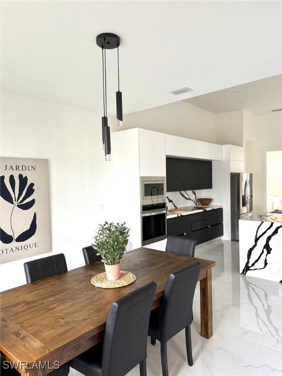 3307 NW 3rd St, Cape Coral, FL 33993 - dining space with marble finish floor and visible vents