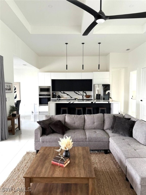 3307 NW 3rd St, Cape Coral, FL 33993 - living area featuring ceiling fan and a raised ceiling