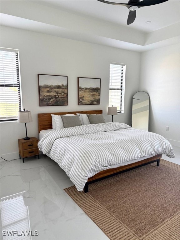 3307 NW 3rd St, Cape Coral, FL 33993 - bedroom with marble finish floor, multiple windows, a ceiling fan, and baseboards