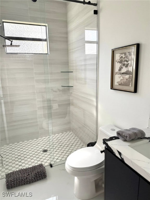 3307 NW 3rd St, Cape Coral, FL 33993 - full bathroom featuring a stall shower, vanity, and toilet