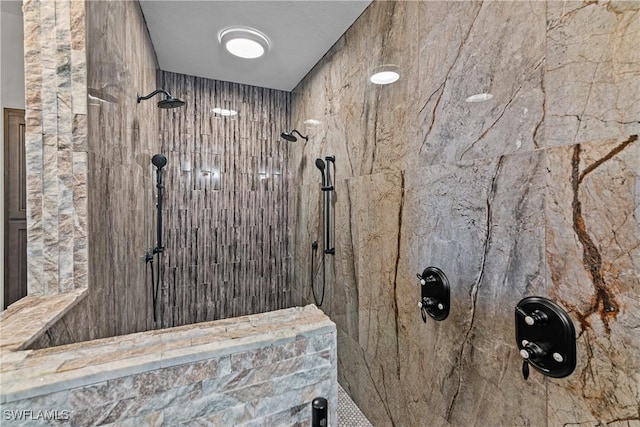 bathroom featuring a tile shower