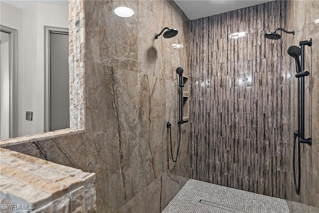 bathroom featuring tiled shower