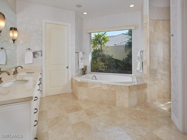 full bathroom with a tile shower, double vanity, a sink, and a bath