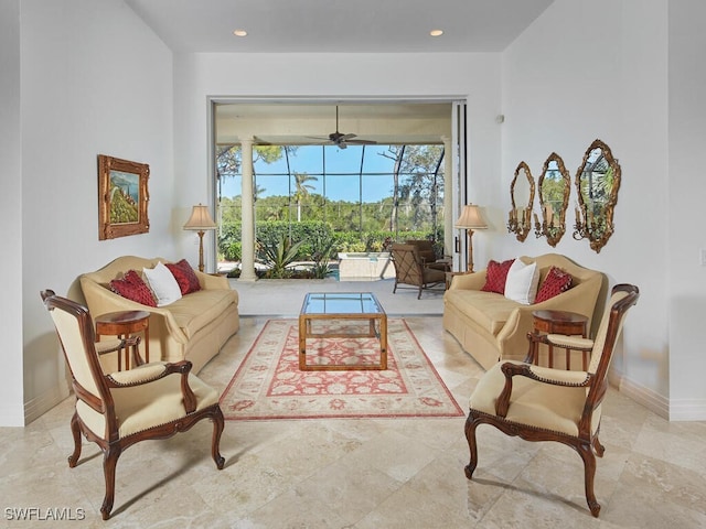 living room featuring recessed lighting, ceiling fan, and baseboards