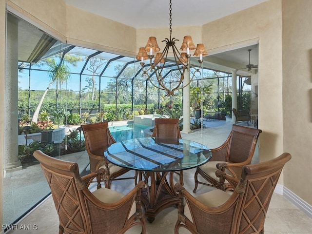 sunroom with ceiling fan with notable chandelier