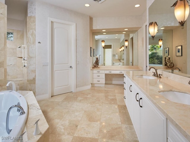 bathroom with a garden tub, double vanity, a sink, and a tile shower