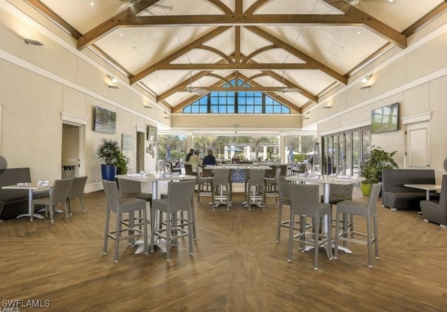 dining room featuring high vaulted ceiling, dark wood finished floors, and beam ceiling