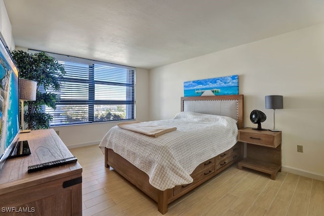 bedroom with light hardwood / wood-style flooring