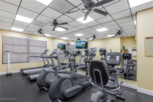 exercise room featuring a drop ceiling