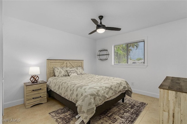 tiled bedroom with ceiling fan