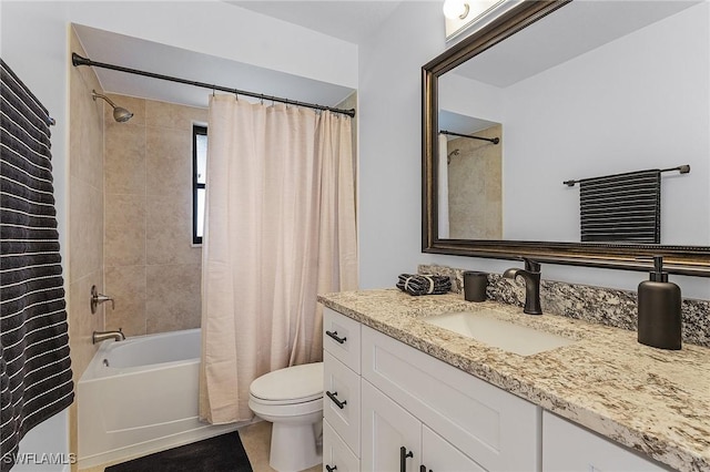 full bathroom featuring tile patterned flooring, shower / bath combination with curtain, vanity, and toilet