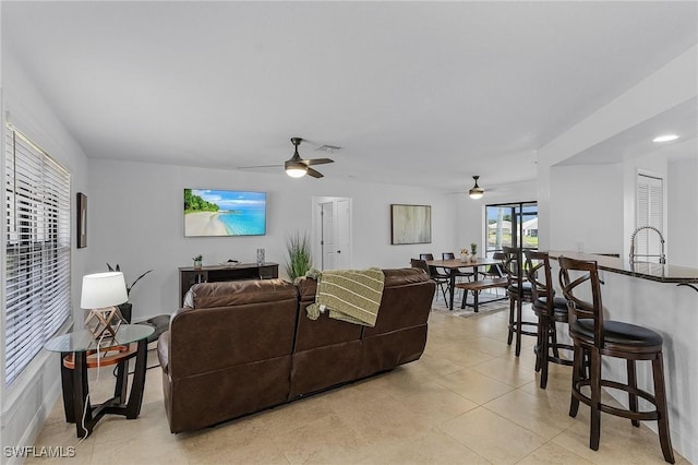 living room featuring ceiling fan