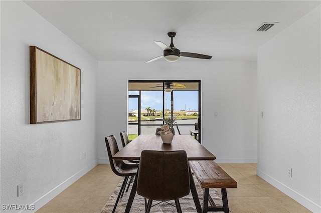 dining area with ceiling fan and light tile patterned flooring