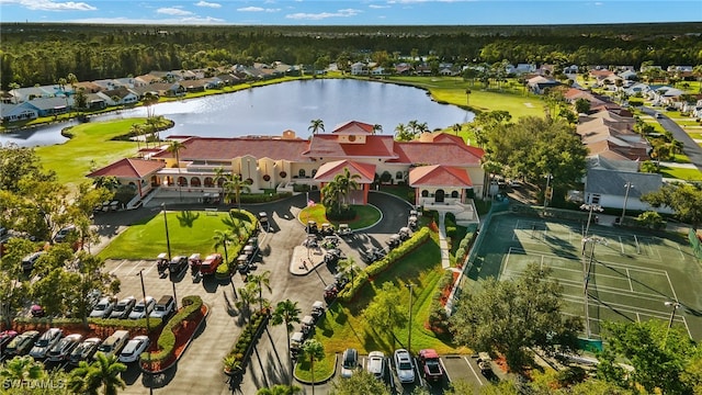 birds eye view of property with a water view