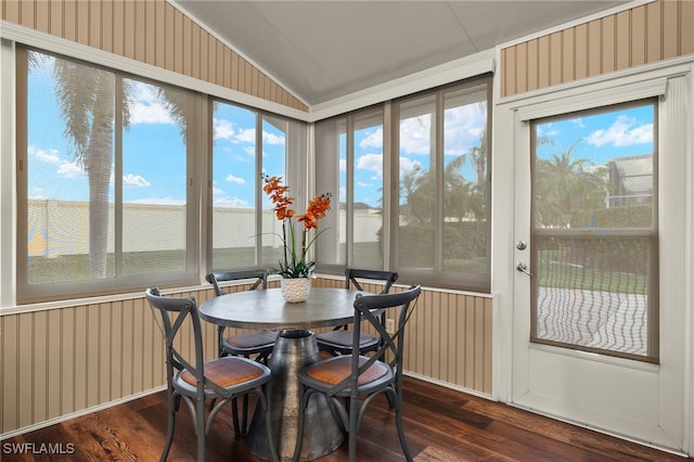 sunroom / solarium featuring vaulted ceiling