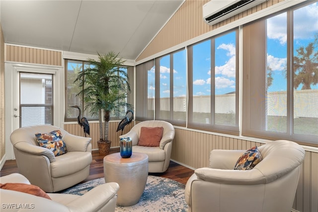 sunroom / solarium with vaulted ceiling, plenty of natural light, and a wall mounted air conditioner