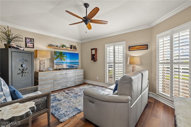 living room featuring dark hardwood / wood-style floors, ceiling fan, and ornamental molding