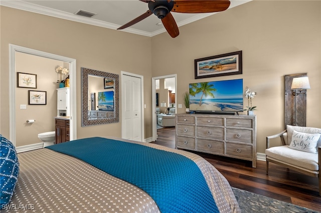 bedroom with ceiling fan, dark hardwood / wood-style floors, ensuite bathroom, a closet, and ornamental molding