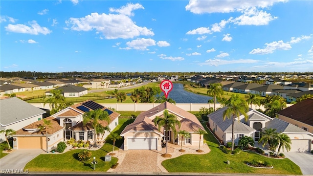 drone / aerial view featuring a water view