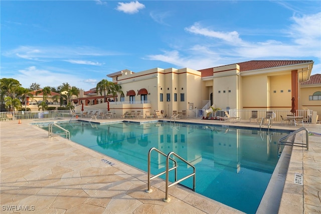 view of swimming pool featuring a patio area