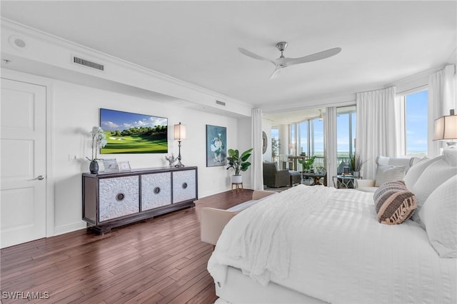 bedroom featuring ceiling fan and dark hardwood / wood-style floors