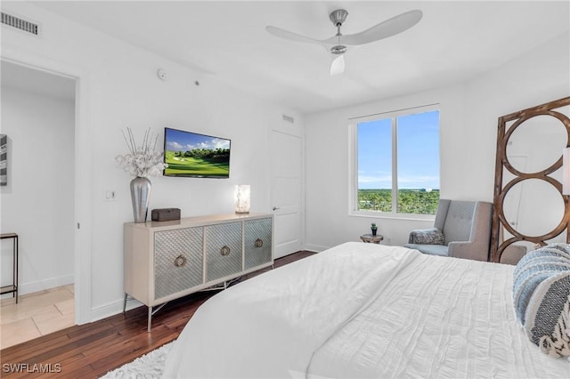 bedroom featuring ceiling fan and dark hardwood / wood-style flooring