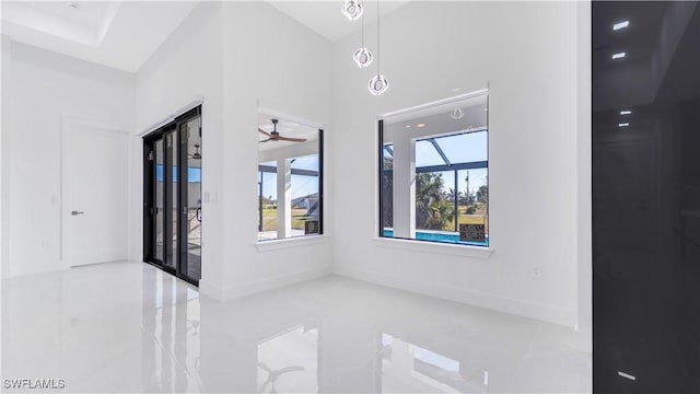 unfurnished room with ceiling fan