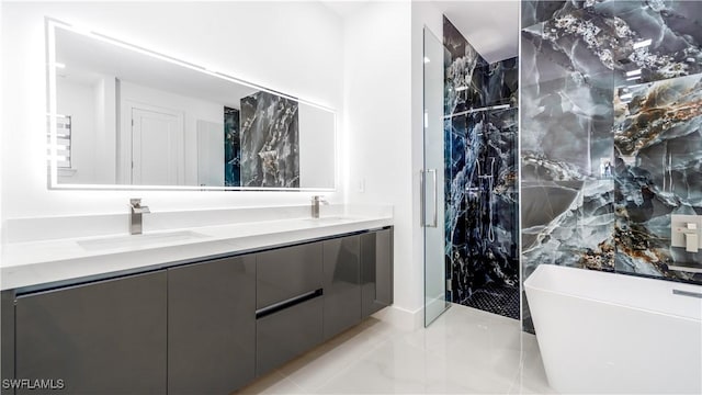 bathroom featuring vanity and separate shower and tub