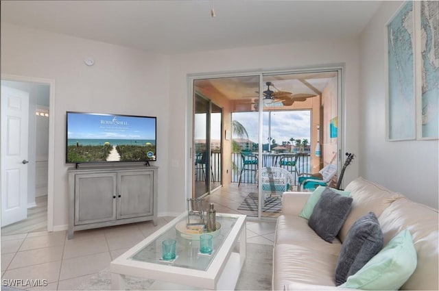 tiled living room with ceiling fan