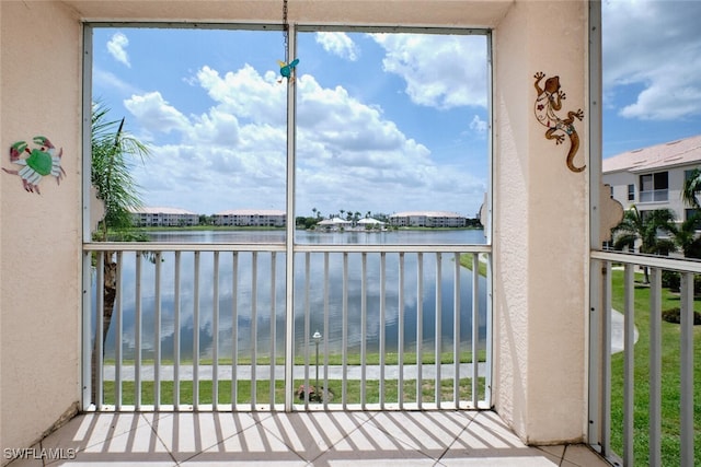 balcony featuring a water view