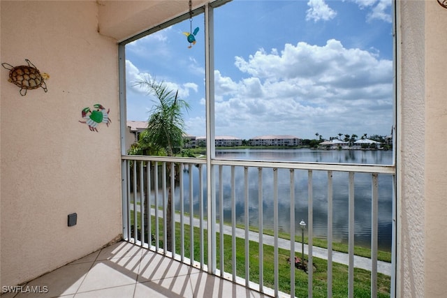 balcony featuring a water view