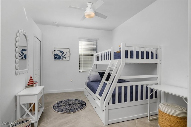 tiled bedroom with ceiling fan